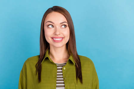 Photo of attractive young happy nice woman smile look empty space isolated on pastel blue color...