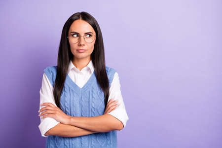 Photo of serious brunette long hairdo lady look empty space wear spectacles shirt vest isolated on...