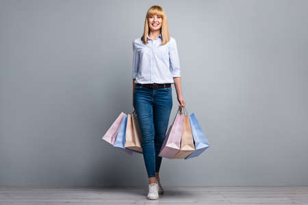 Full body photo of marketer lady get salary spend shopping bags low prices offer wear denim isolated...