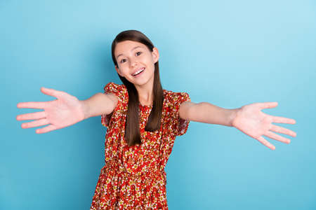 Photo of youth cheerful lady good mood open arms welcome cuddle isolated over blue color backgroundの写真素材