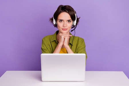 Photo of young woman confident consultant coworking agent headphone speaker isolated over violet...