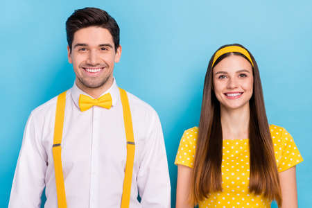 Photo of funny attractive young sister brother wear pinup clothes smiling isolated blue color backgroundの写真素材