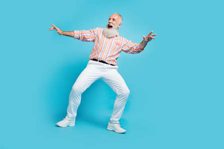 Full body photo of handsome excited aged man happy positive smile dance discotheque isolated over...