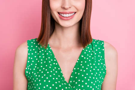 Cropped photo of young charming girl toothy smile clinic veneers hygiene whitening isolated over pink color backgroundの写真素材