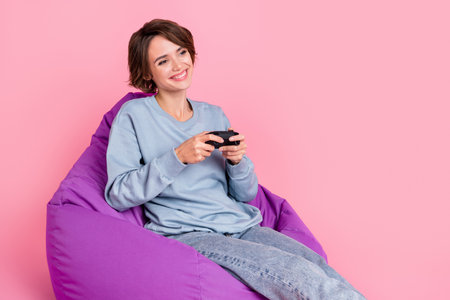 Photo of impressed young lady  wear sportswear jeans isolated on pink background