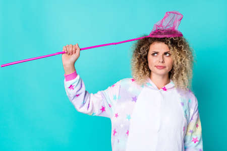 Photo of doubtful unhappy woman sleepwear catching nettle head looking empty space isolated...