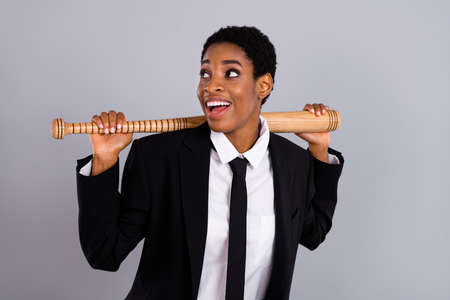 Photo of young man woman curious look empty space player bat sport isolated over grey color backgroundの写真素材