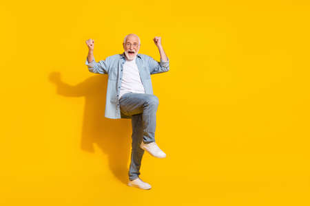 Full length body size view of attractive funky cheerful grey-haired man rejoicing great news...