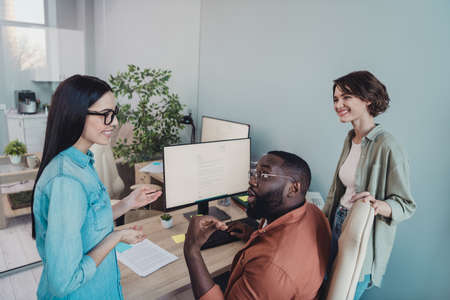 Portrait of attractive cheerful smart clever group discussing communicating developing project in...