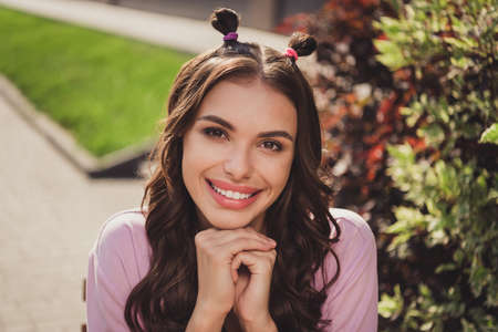 Portrait of attractive cheerful wavy-haired girl enjoying rest spending spare time fresh air...