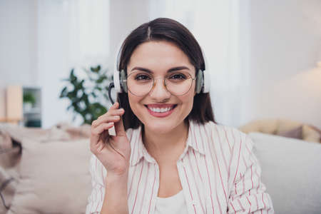 Portrait of attractive cheerful skilled woman answering call insurance consulting support care at...
