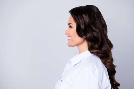 Profile photo of optimistic hr brunette wavy young lady look promo wear blue outfit isolated on grey...