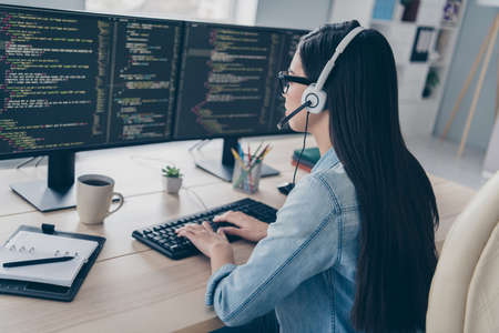 Profile side view portrait of attractive smart clever long-haired girl editing script database...