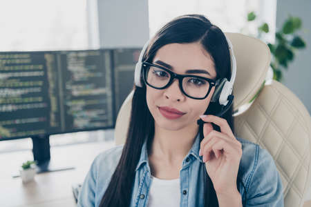 Portrait of attractive skilled smart clever long-haired girl expert technician answering calls...