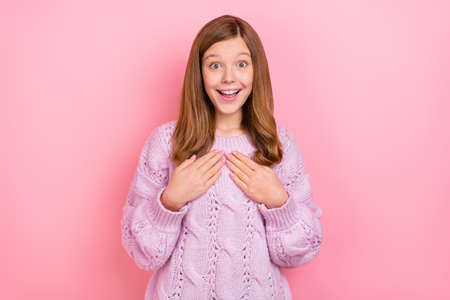 Portrait of attractive amazed girly girl good incredible news reaction choose me isolated over pink pastel color backgroundの写真素材