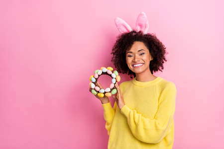 Photo of sweet pretty woman dressed kitted pullover easter headband holding wreath empty space...