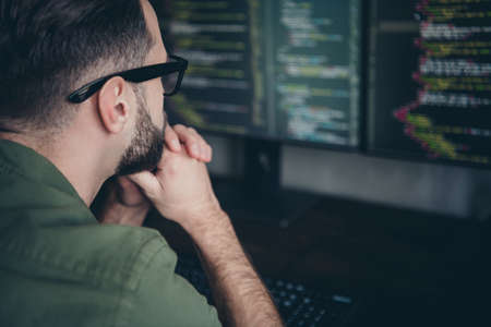 Profile side view portrait of attractive smart clever skilled guy solving task building process at workplace workstation indoorsの写真素材
