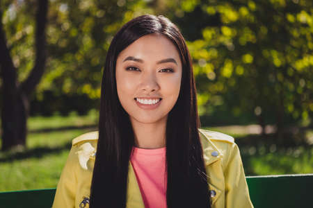 Portrait of attractive cheerful girl enjoying weekend sunny day daydream summertime trip good mood outdoorsの写真素材