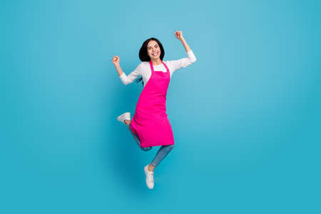 Full length body size view of attractive cheerful girl expert jumping having fun isolated over bright blue color backgroundの写真素材