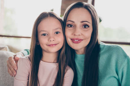 Photo of old dream positive lady embrace little girl daughter wear casual outfit in comfortable home...