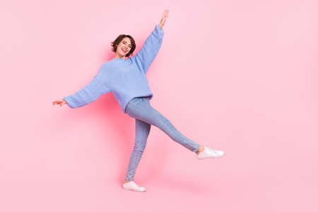 Full size photo of positive excited girl have fun chilling free time weekend isolated on pink color...