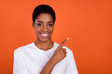 Photo of transgender woman point hand empty space advise choose promotion isolated vibrant color backgroundの写真素材