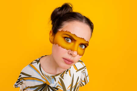 Illustration of female indigenous woman painted tribal face art drawing look suspicious close up isolated yellow color backgroundの写真素材