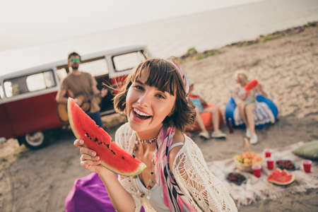 Photo of millennial funky friends picnic on coast minivan on holiday trip wear trend cloth outsideの写真素材