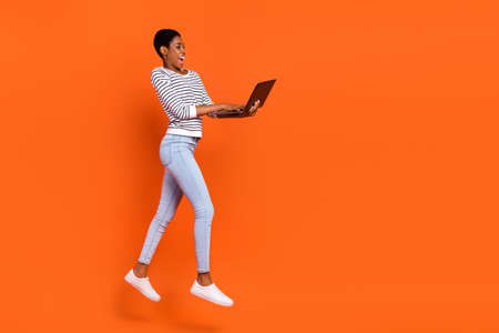 Photo of charming pretty third gender person wear pullover jumping writing device empty space...