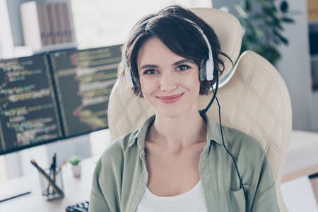 Portrait of attractive skilled cheery girl technician expert providing remote customer web site...