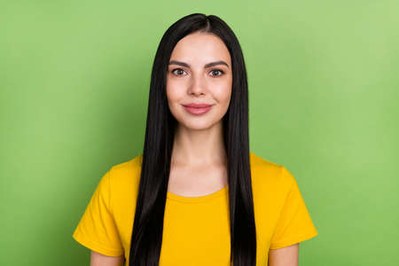 Photo of young lovely lady wear casual outfit intelligent summer isolated over green color backgroundの写真素材