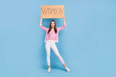 Full body photo of gorgeous satisfied person hold paper card woman rights isolated on blue color backgroundの写真素材