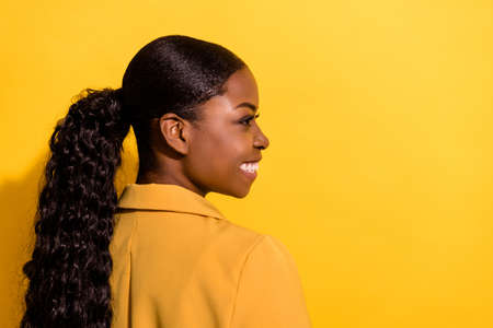 Profile photo of nice wavy young fancy lady look promo wear jacket isolated on yellow color backgroundの写真素材