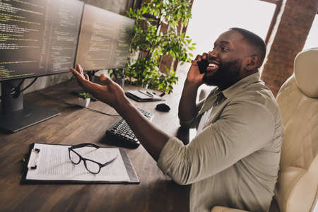 Profile side view portrait of attractive cheery skilled guy manager calling client discussing...