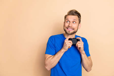 Photo of young cheerful man interested look empty space station competition weekend isolated over...