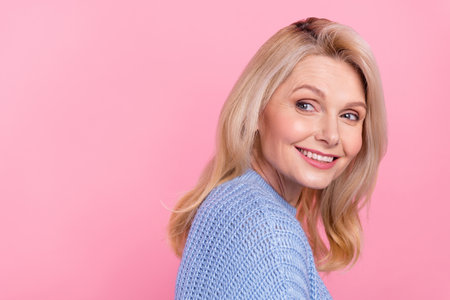 Profile photo of senior nice blond lady look promo wear blue pullover isolated on pink color...