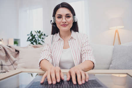 Portrait of attractive focused skilled woman answering call insurance support care typing email...