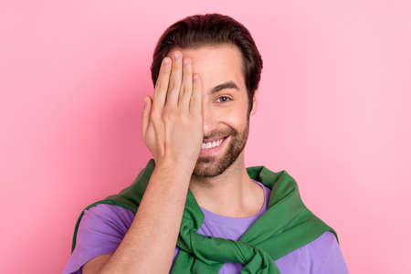 Photo of cute young beard man close face wear t-shirt pullover isolated on pink color backgroundの写真素材