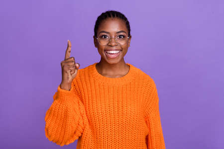 Photo of attractive positive girl point finger up excellent brilliant look camera isolated on violet...