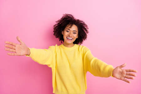 Photo of shiny adorable woman dressed kitted pullover open arms ready hug you isolated pink color backgroundの写真素材