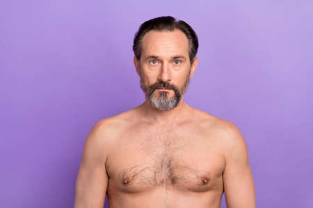 Portrait of handsome good looking nude shoulders male visit spa salon body care isolated on purple color backgroundの写真素材