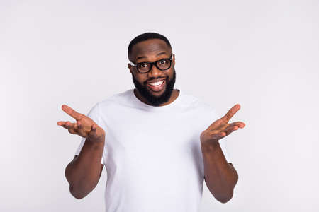 Photo of cute charming guy dressed casual t-shirt eyeglasses telling speaking you isolated white...