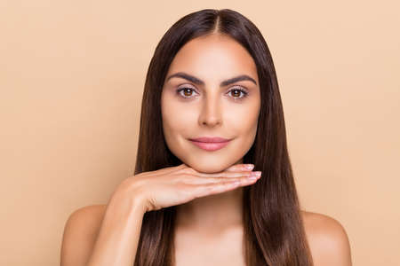 Portrait of tanned lady hand chin apply silky soft cream lotion look effect isolated pastel color...