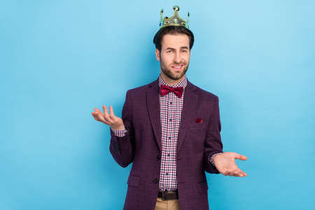 Photo of young handsome man confused unsure puzzled hesitate think isolated over blue color backgroundの写真素材