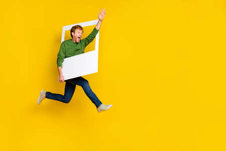 Full length photo of impressed pretty man wear pullover tacking photo waving arm empty space...