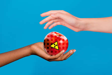 Exclusive dynamic magazine sketch collage of palms arms sharing red radioactive apple isolated blue...