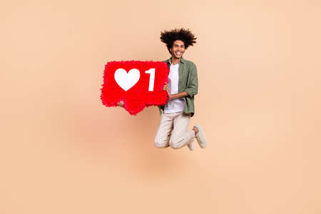 Full length body size view of attractive cheery trendy guy jumping holding count like board isolated...
