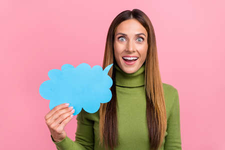 Photo of inspired lady hold paper speech bubble tell say share unbelievable novelty isolated pastel...