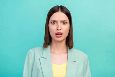 Photo of unsatisfied pretty person look camera cant believe sullen eyebrows isolated on turquoise...