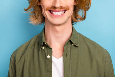 Cropped view portrait of attractive cheerful guy perfect beaming smile whitening teeth isolated over...